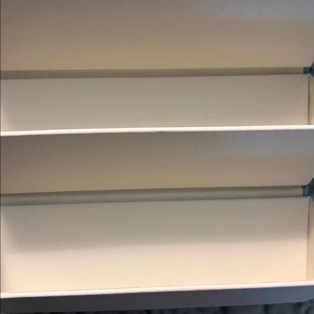 Six compartment roll up glass case.